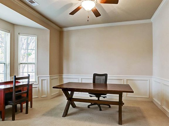 To the left of the entrance is the Study that has a triple bay window which looks out over the front of the home. This room features double French doors, crown and chair molding detail. You can work from home in a bright and cheerful space.