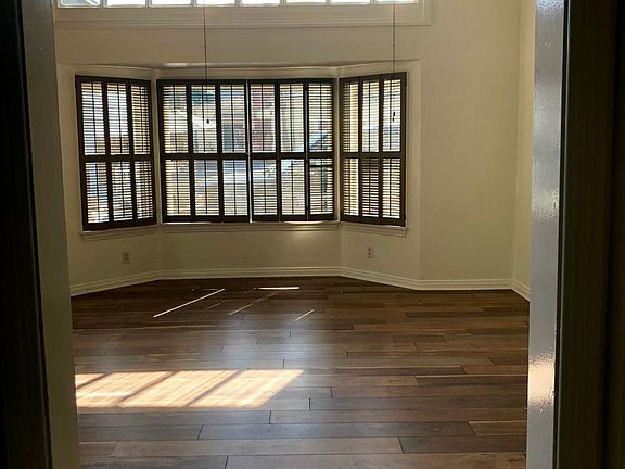Natural light throughout (view from hallway into the living room). New floor.