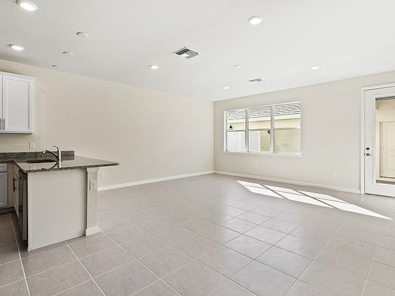 Open floor plan with connecting tile floors and plenty of room to entertain