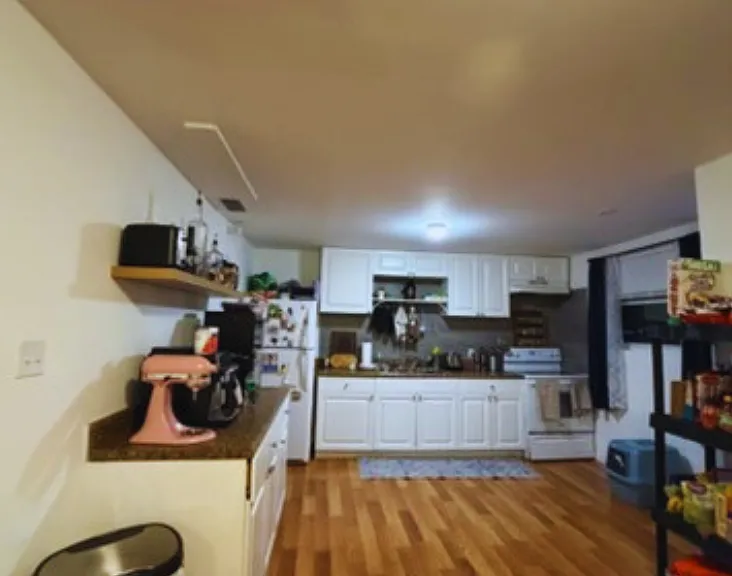 Generous kitchen with abundant storage and a stove with oven.
