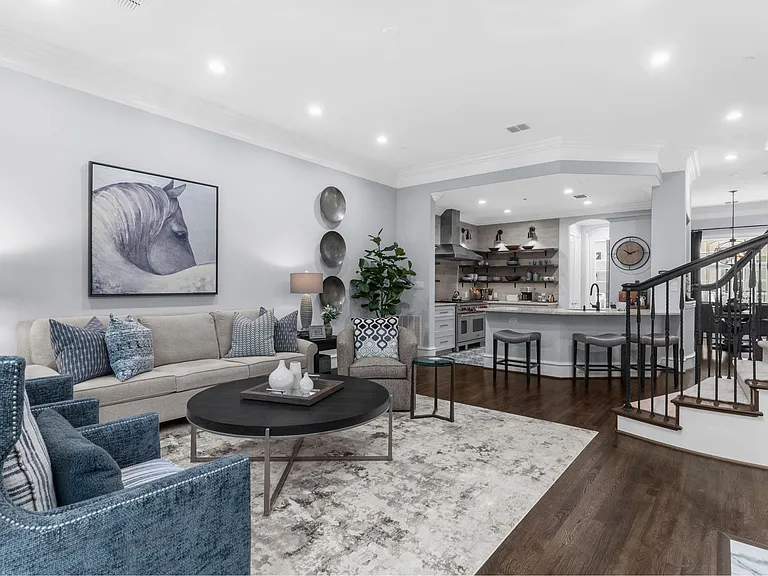 Elegant 2nd-floor living space featuring a cozy fireplace and seamless flow.