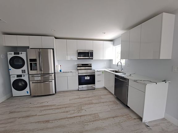 Two bedroom apartments have super large refrigerators. And, convenient laundry.