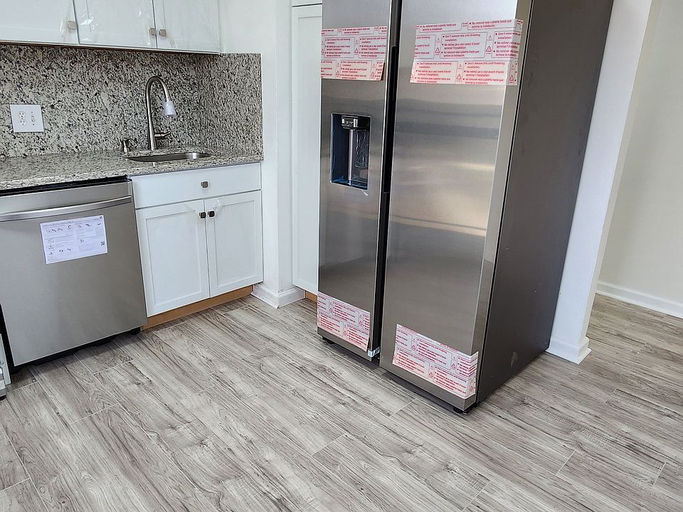 Kitchen - all new appliances (gas stove, microwave, quiet dishwasher, large capacity fridge with water and ice dispenser), with exquisite granite countertops and back splash. Additional cabinets allow for ample room.