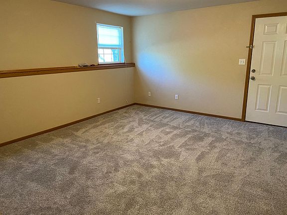 downstairs bedroom with attached bath and exit door