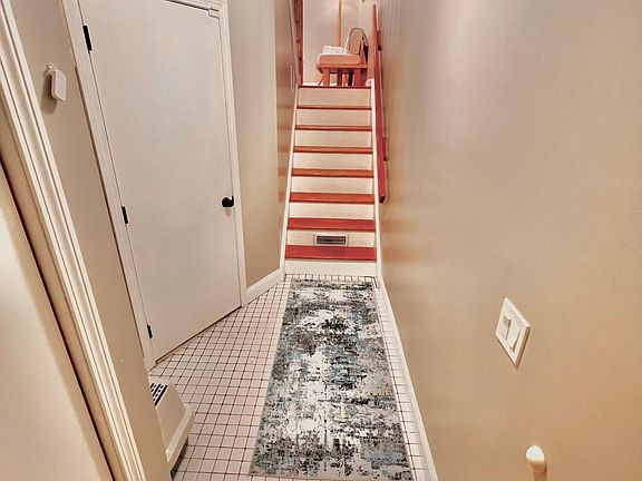 hallway from entrance, the door on the left opens to the garage and basement