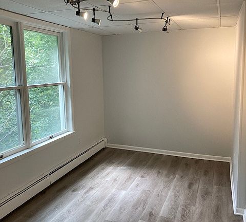 Bedroom #2 features artistic track lighting