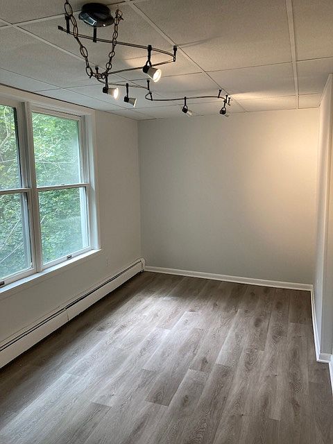 Bedroom #2 features artistic track lighting