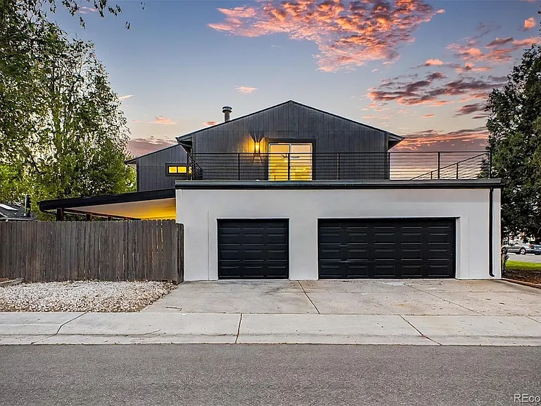 Oversized 3-car garage. Deck from primary bedroom above with brand new Trex decking and metal railings