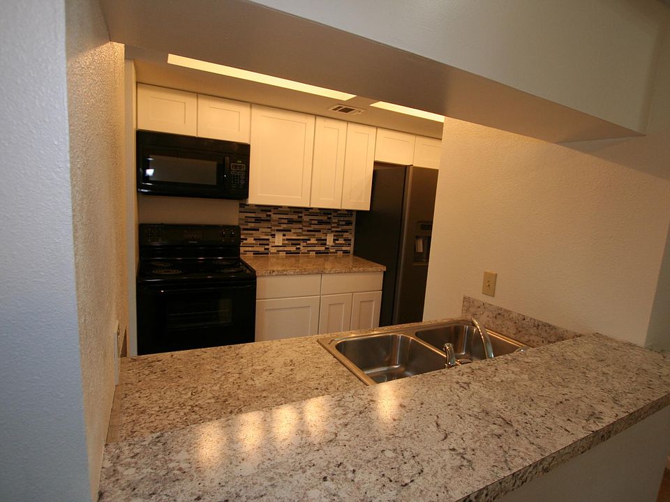 Newly remodeled kitchen including cabinetry, counter tops and back splash.