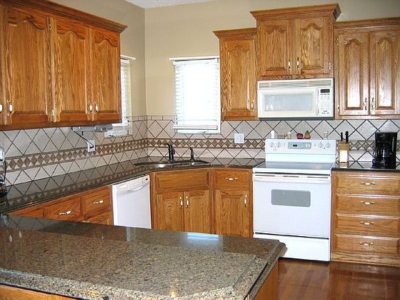 Granite counters Tile backsplash