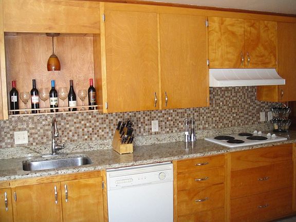 Kitchen - New granite and tile backsplash