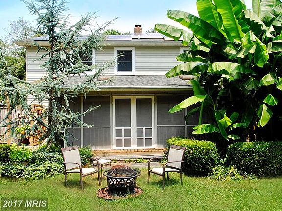 Screened Porch Opening to Yard w/ Exotic Plantings