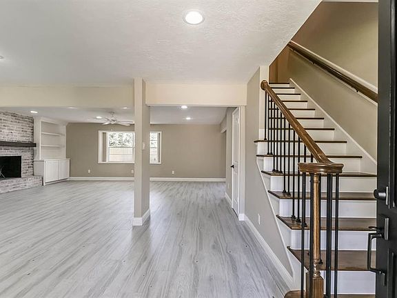 As you walk in you are greeted by wood like tile floors that expand throughout the first floor and bathrooms.