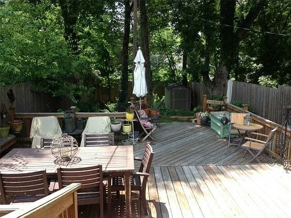 Large, private back deck with 8 ft privacy fence