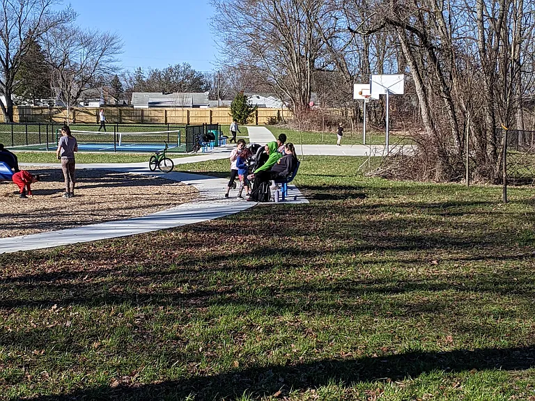 You can see the pickleball and basketball court and the walking path that surrounds the park.