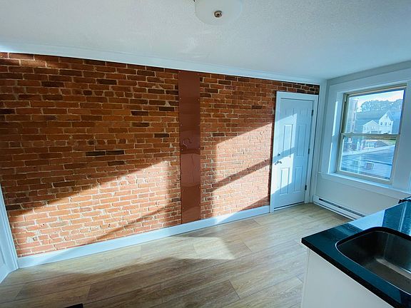 Exposed brick wall in kitchen