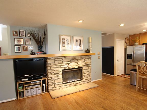 Cozy stone fireplace will warm the heart of your home.
