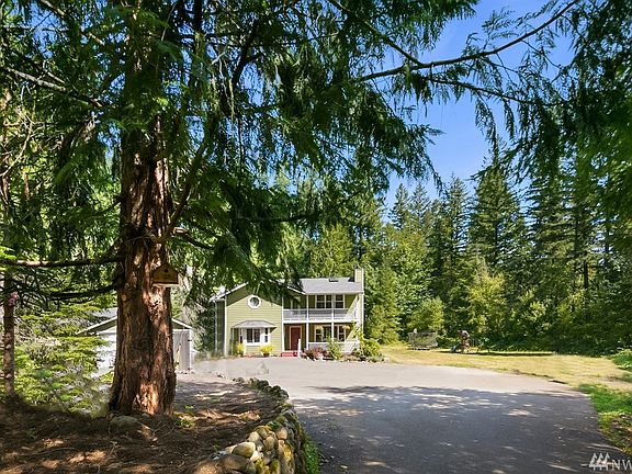 This peaceful and private retreat is nestled on a shy 5 acre lot.