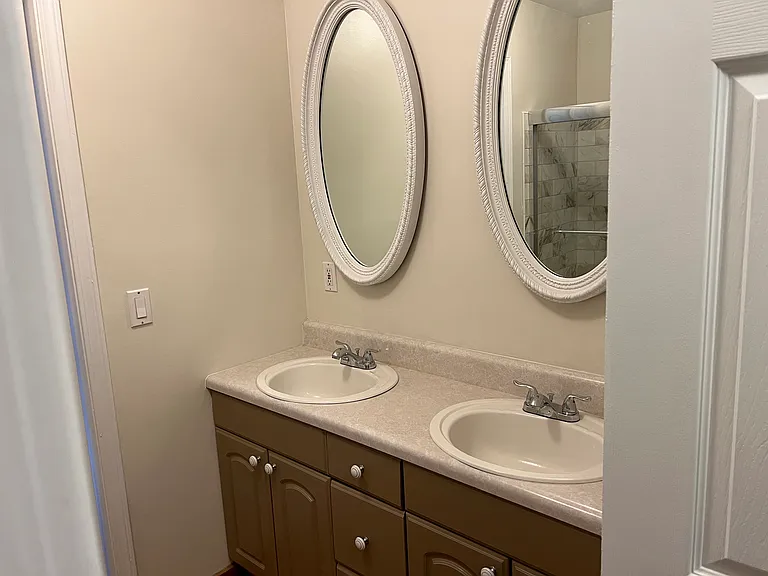 Double vanity, main level shared bathroom.