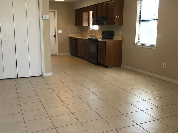 View from font door into living, dining kitchen area
