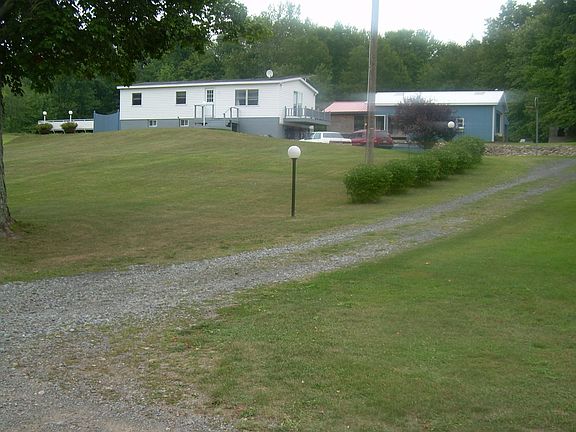 small addition on barn w/red roof has since been sided 