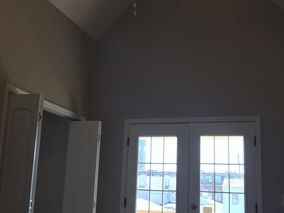 French doors lead to deck off back master bedroom