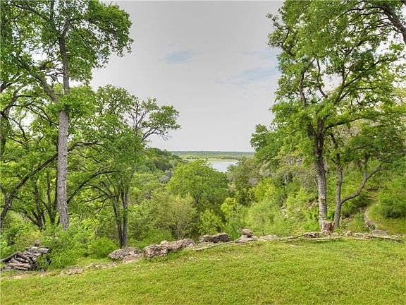 With TONS of outdoor living, a lake view, and 3.3 gorgeous acres, this is the quintessential Hill Country Home!