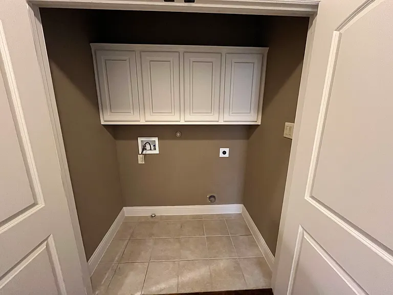 Utility room with cabinets