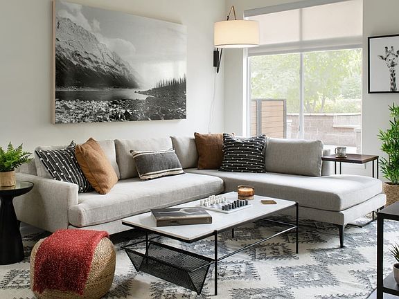 Spacious living room with wood-style flooring and large windows