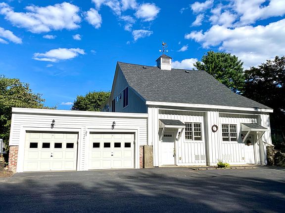 Entrance to the #5 is the door on the left, and the garage for this property is the garage door on the right, closest to the main entrance to #5