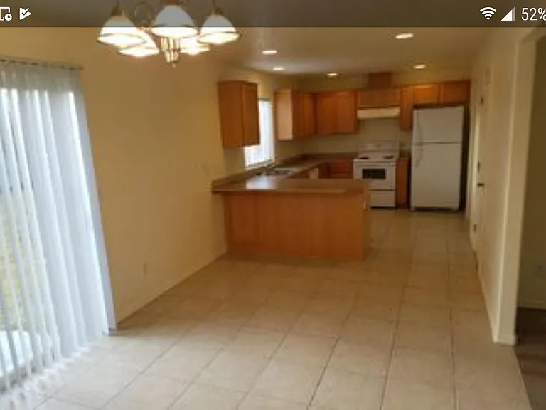 Large dining room with slider door to backyard