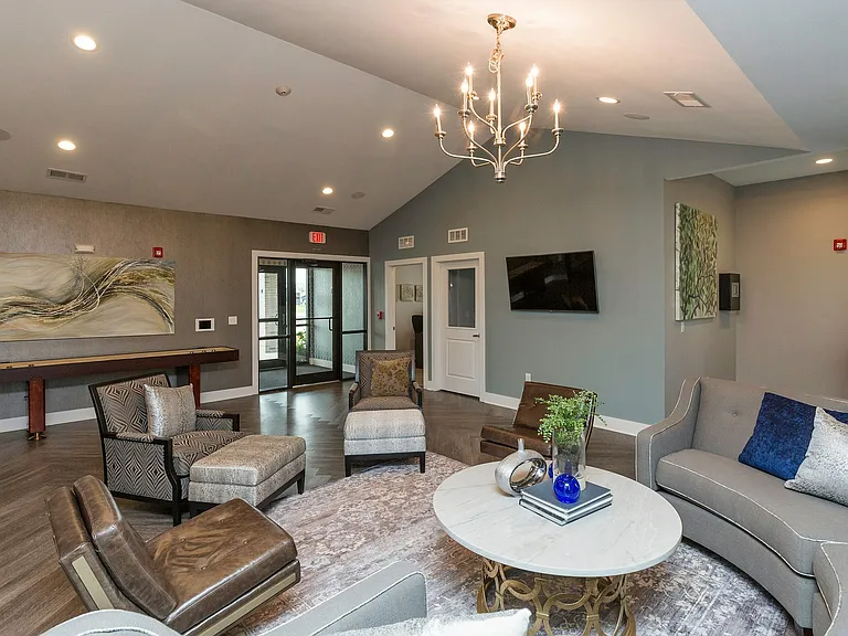 Kick back and connect in the expansive entertainment room at the Legacy Landing clubhouse_perfect for gatherings and relaxation.
