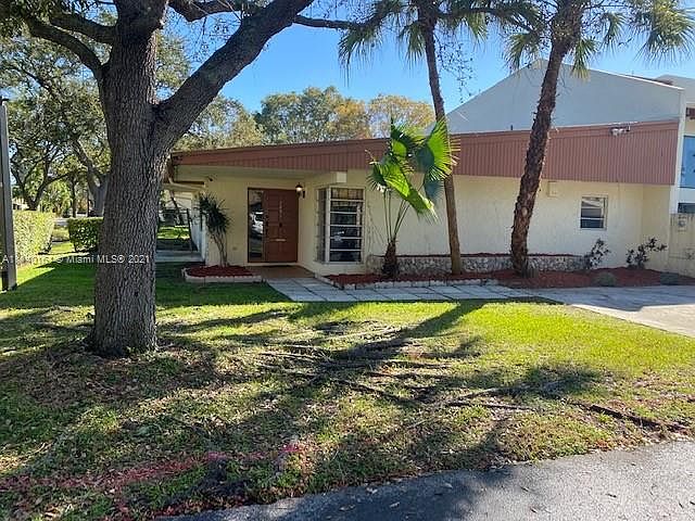 Front of one story home, 2 parking spots