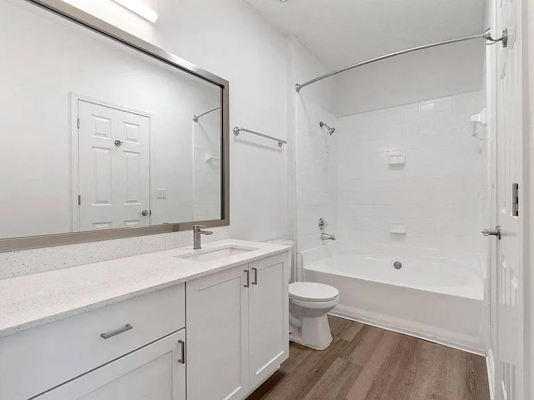 Renovated, spa-inspired bathrooms with large mirrors