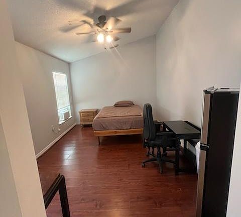 Queen bed, desk, refrigerator, big tv and microwave.