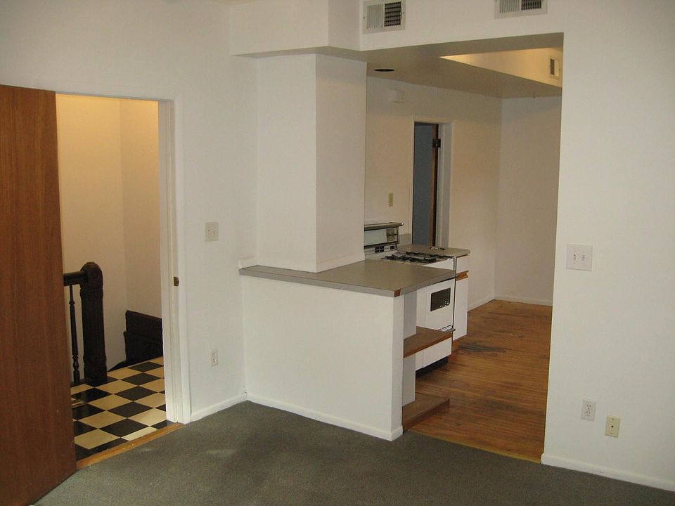 LR w/staircase and  Kitchen