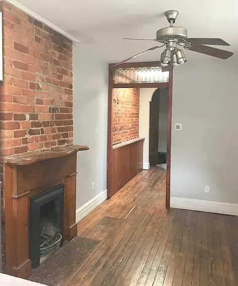Den or dining area. Skylight in hall with custom leaded glass over entryway.