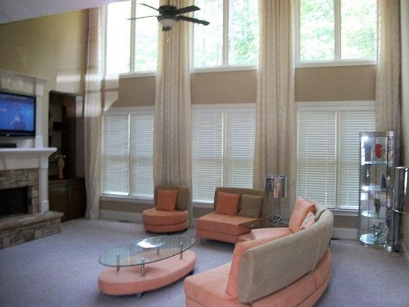 living room area including high vaulted ceilings