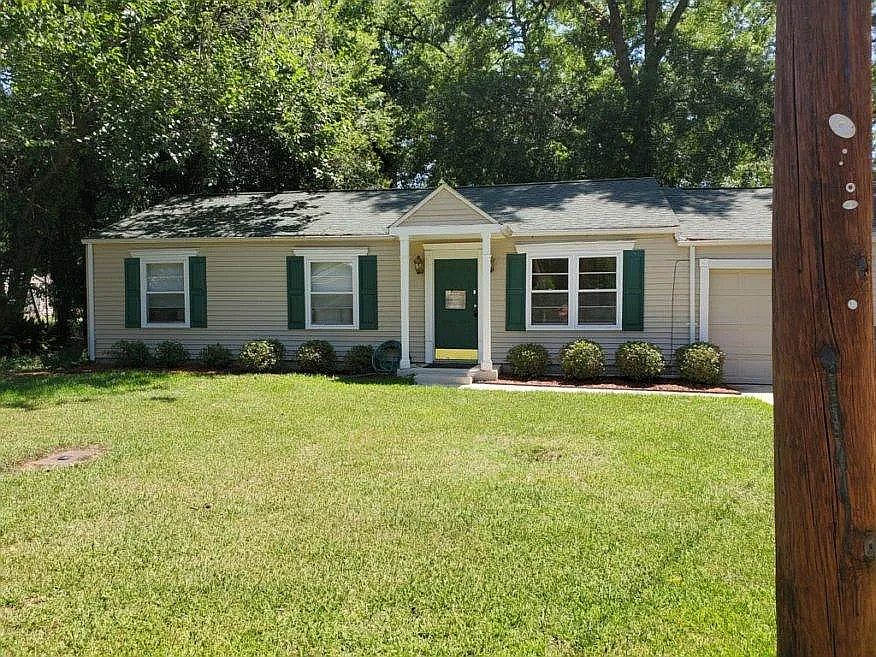 front view, mature landscaping