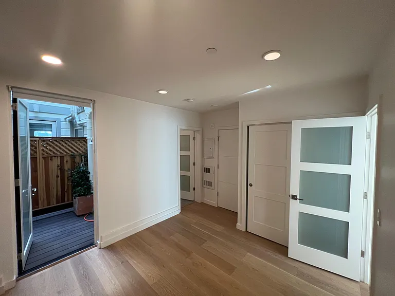 Bedroom facing lightwell deck and bathroom