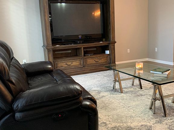 See the space I was talking about!? Even this beautiful massive entertainment piece looks like a decadent addition to your homes TALL ceilings!