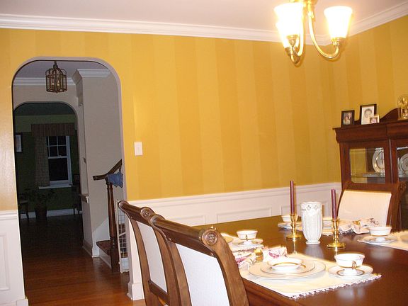 Dining Room featuring Custom Paint and Wainscotting