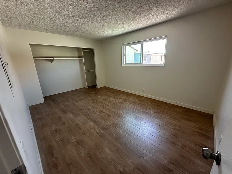 Large Bedroom #2 with LARGE Closet (Photo does not show installed new closet doors & New window blinds