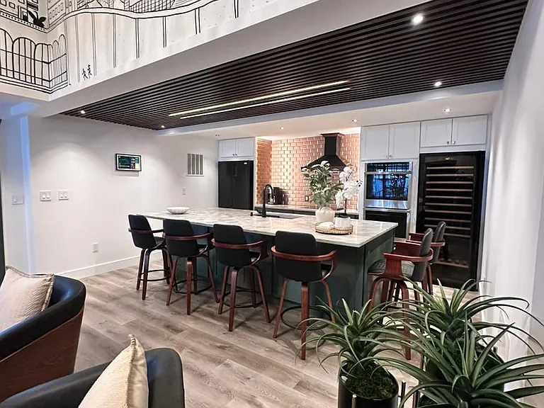 Luxury kitchen with oversized island and elegant finishes.