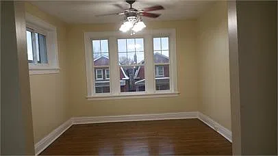 Spacious Living Room, Gorgeous Refinished Hardwood Floors & Brand New Windows Throughout!