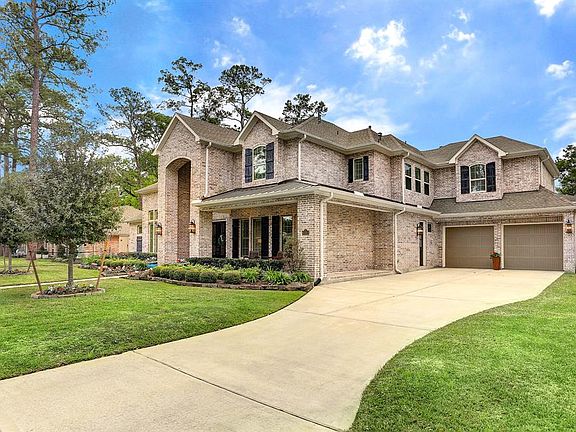 This gorgeous, custom, brick home offers 5 bedrooms, 5 full baths, one half bath, and a THREE car garage and a inviting wrap around front porch! Two bedrooms are located downstairs and the three upstairs secondary bedrooms are spacious and all are en