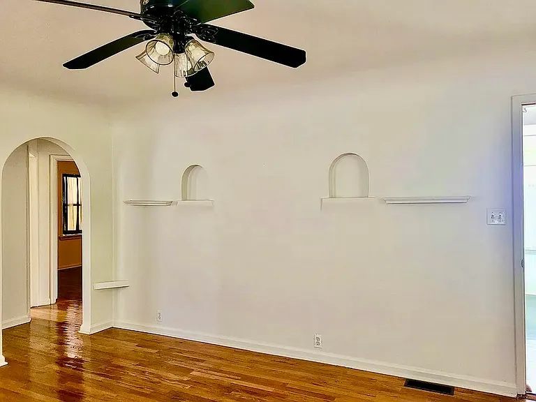 Notice original plaster arches as features of this era. Two plaster arch niches to display your treasures.