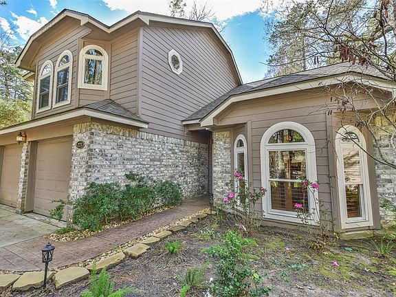 Exterior features brick with hardi siding & lovely arched windows