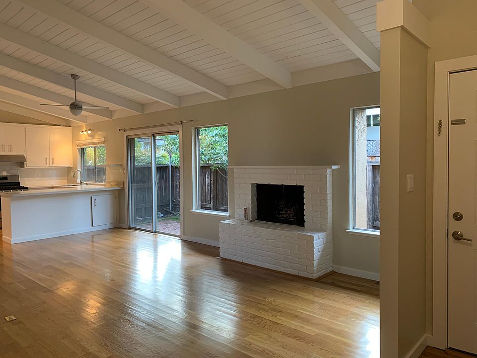 Living room, patio door, backyard, and kitchen