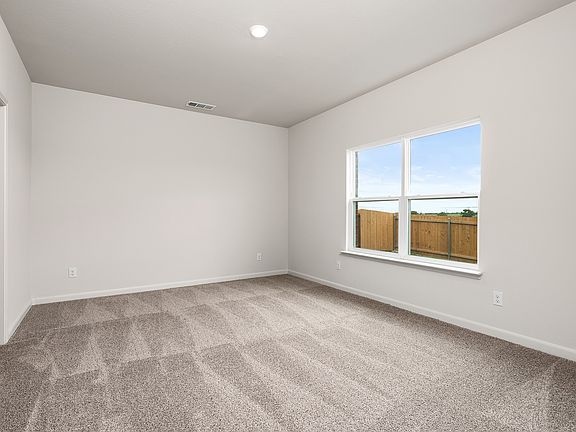 The master suite has a large bedroom, ensuite bathroom and a walk-in closet.